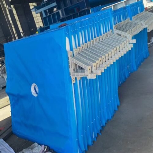 Blue filter cloths installed on filter press for industrial solid-liquid separation
